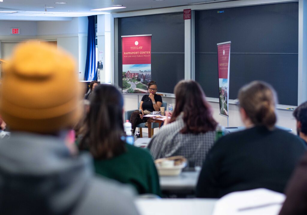 President & CEO Kim Janey seen through a crowd of seated attendees.